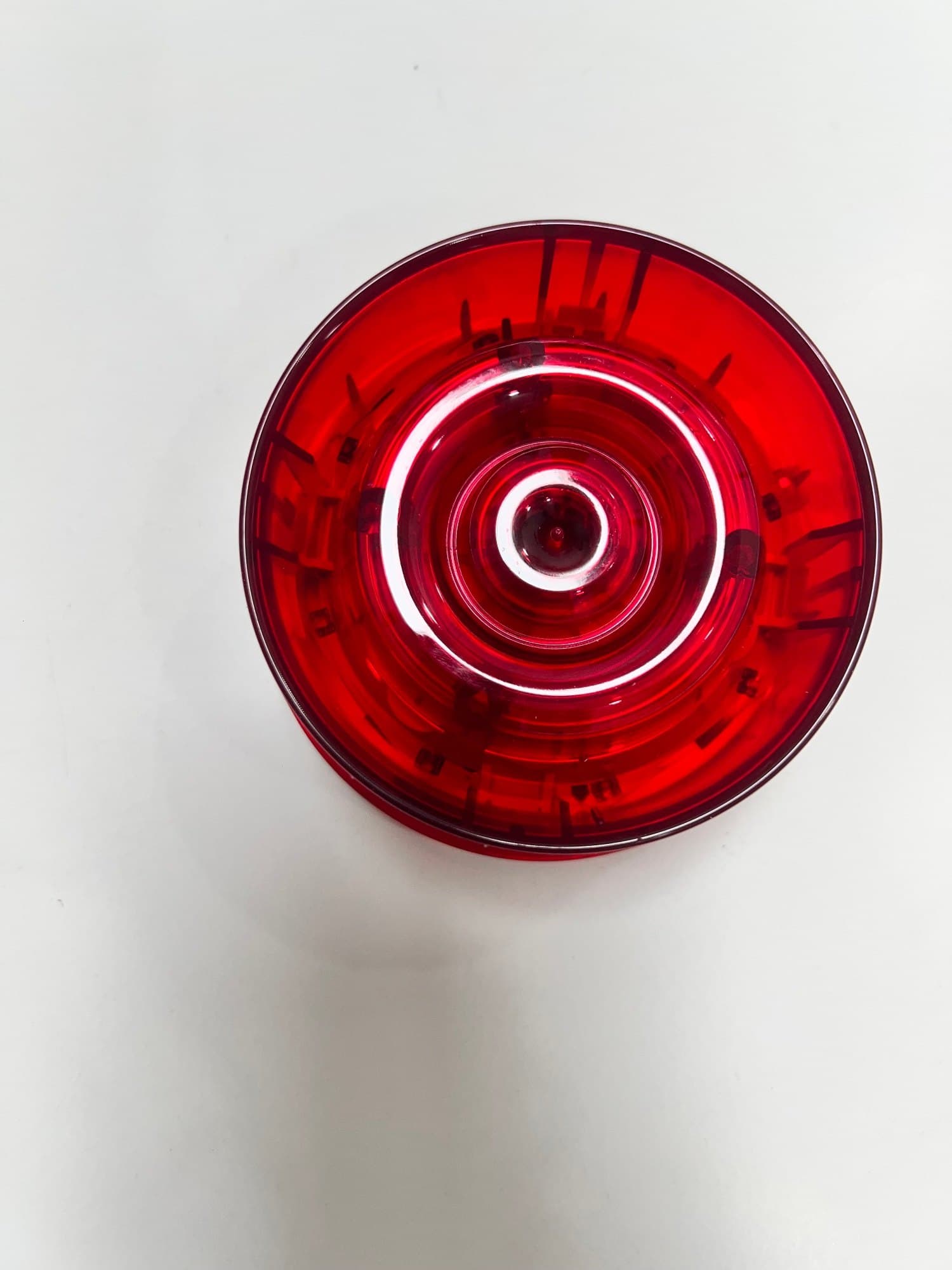 Non-isolated wall sounder strobe with red flash; pure white body.